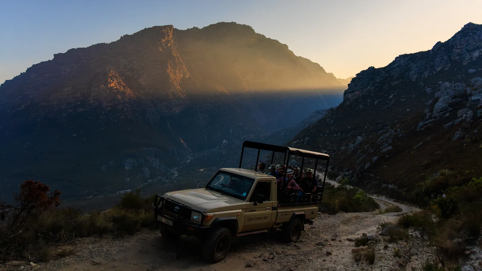 The Cape Canopy Tour 4x4 on the mountain track, with low sun on the peaks of the Hottentots Holland Nature Reserve